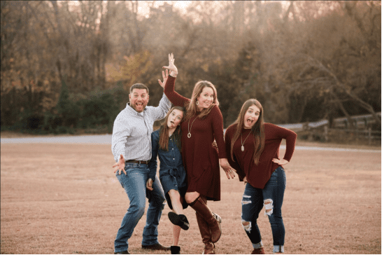 Family Portrait Session | 5 Important Factors To Consider 1 Family Of Four Playfully Posing Outdoors For A Family Portrait Session In Dallas