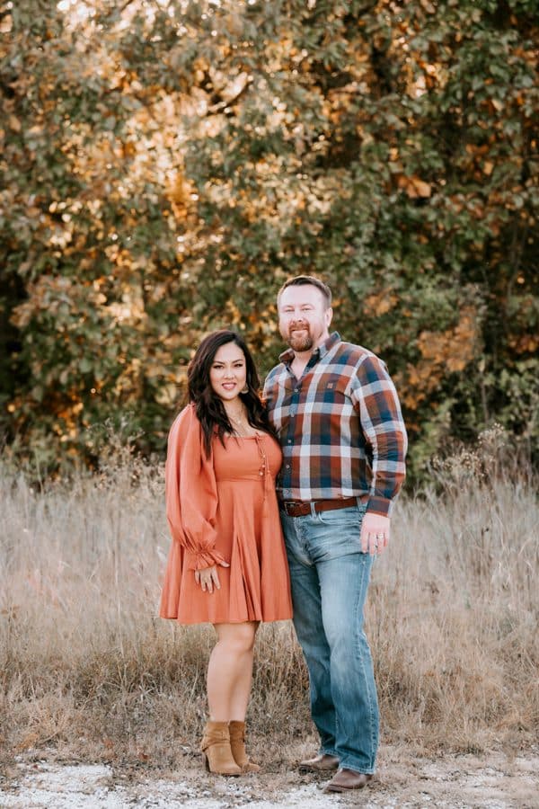 Couples Photography Posed Looking At Camera For Family Portraits During A Family Photoshoot In Dallas