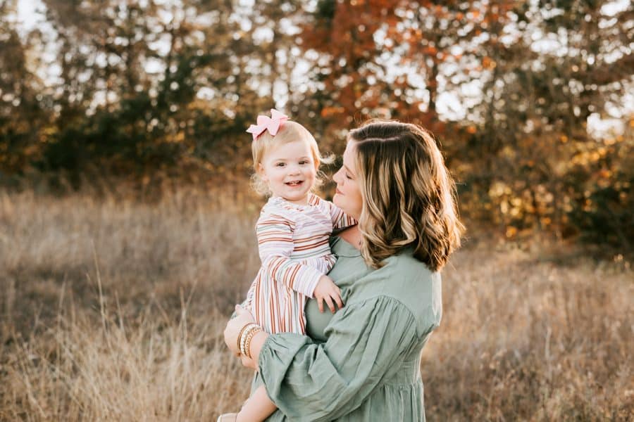 Family Photographed Outdoors Smiling At Camera For A Family Photoshoot In Dallas