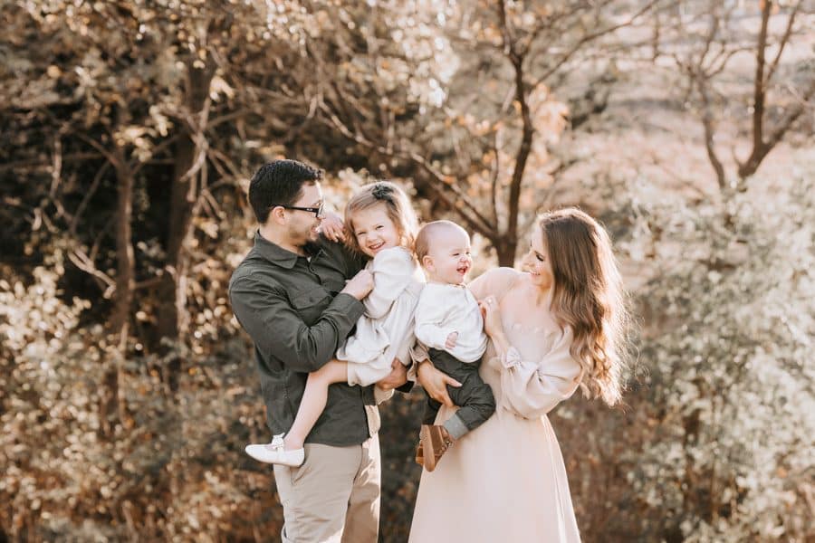 Beautiful Family Portraits With Two Children Laughing With Family Photographer In Dallas