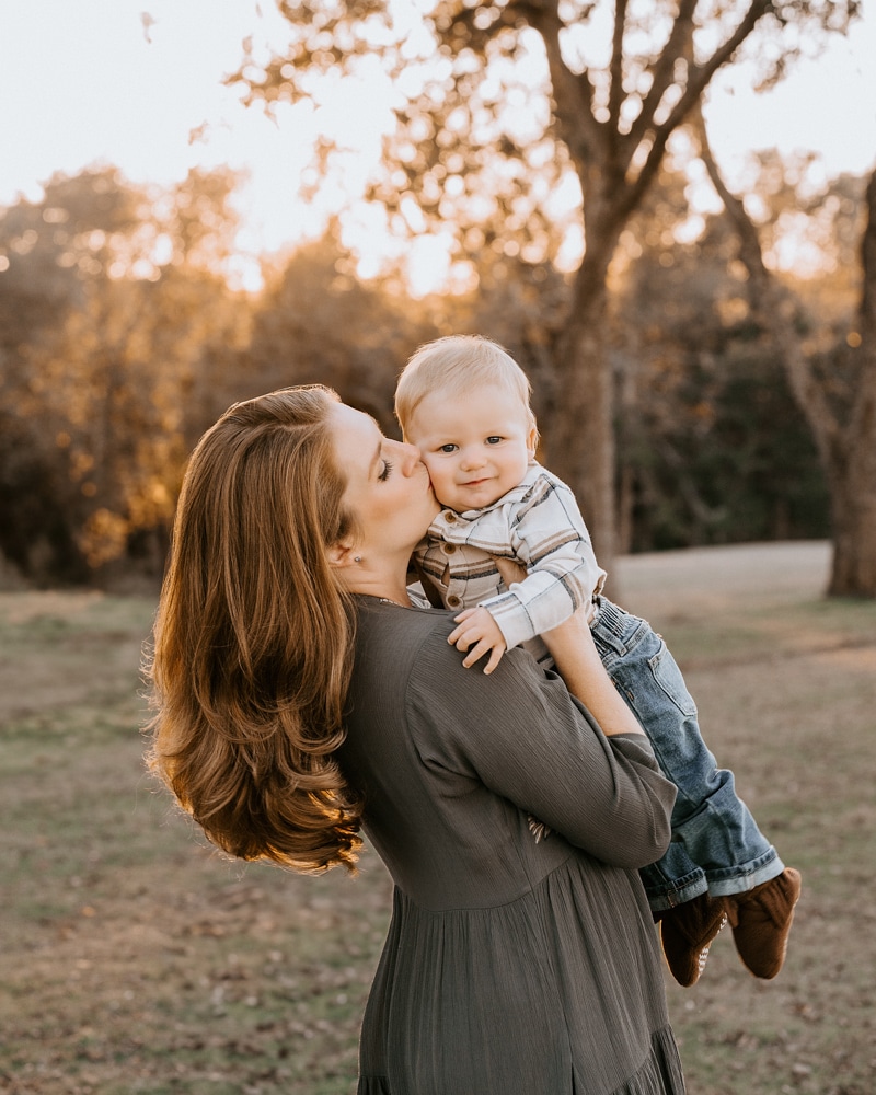 mother kissing baby boy for perfect photographs with dallas family photographer